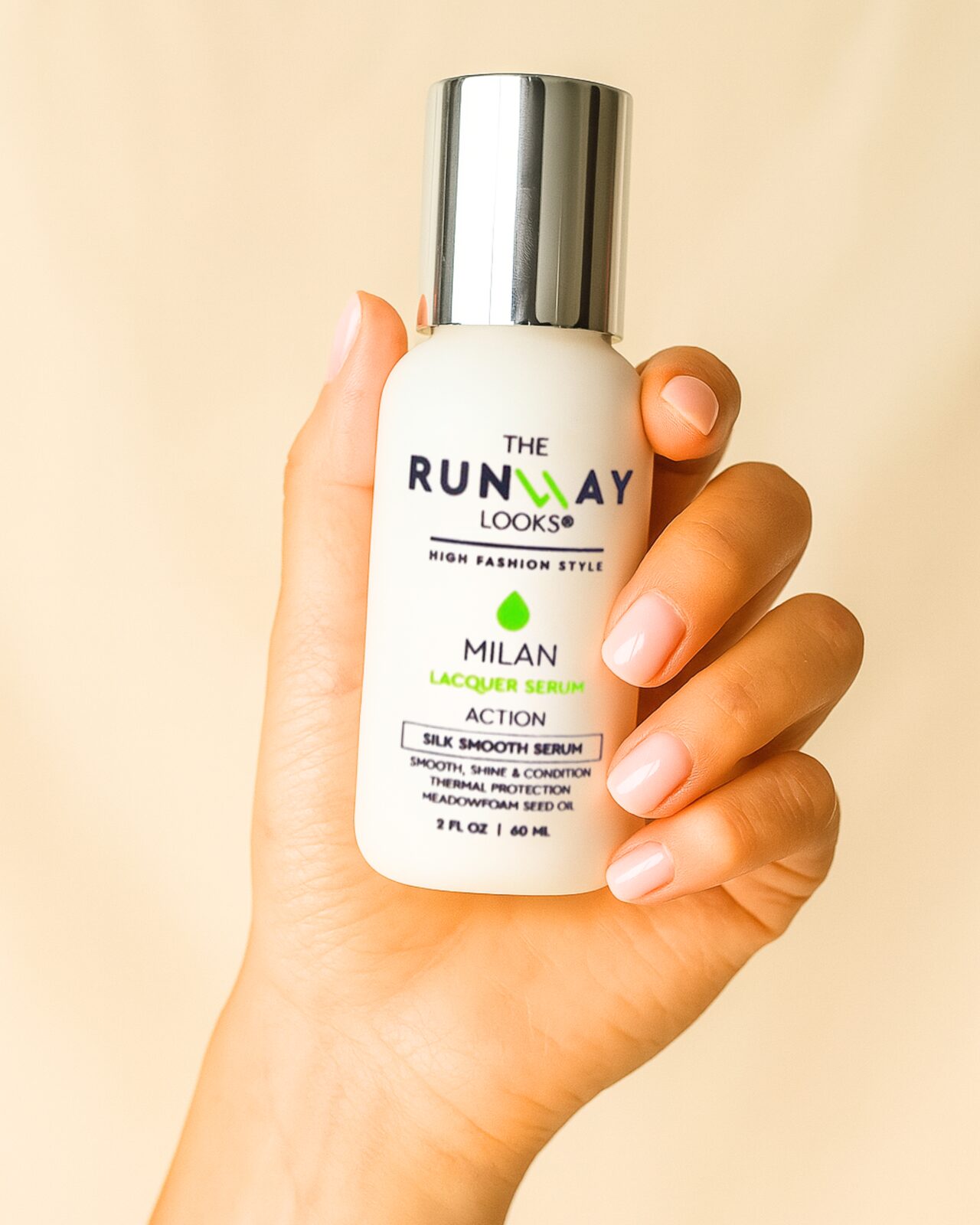The Runway Looks Lacquer Serum applied to smooth hair